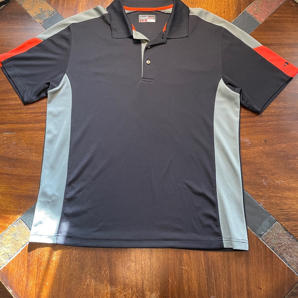 Grand Slam Performance Men’s Polo Shirt. Size L/G. Color Black & Gray RN# 37763.